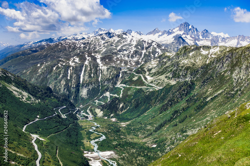 Upper Valais landscape viewed from Furka Pass with the road to Grimsel pass on the background, Switzerland