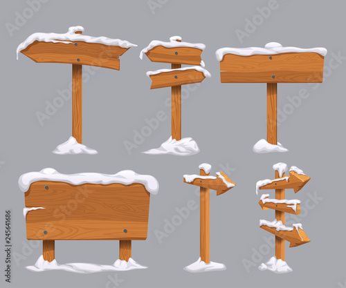wooden directional signs set with snow