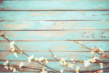 Cherry blossom flowers on vintage wooden background, border design. vintage color tone - concept flower of spring or summer background
