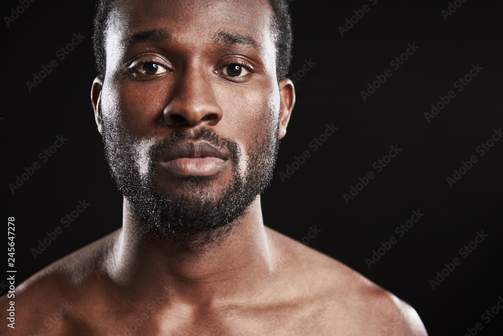 Close up of an afro American man looking at the camera Close up of an afro American man looking at the camera