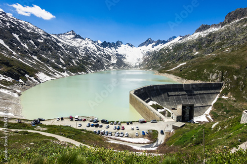 Photos Oberaarsee dam and Oberaar glacier near Grimsel Pass in a beautiful summer day,