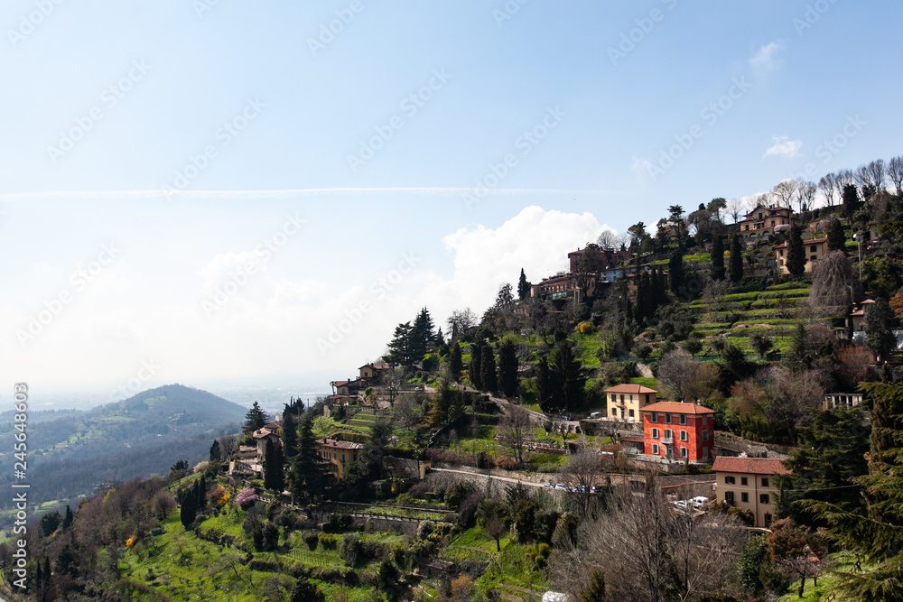 colored houses on a mountain in italy bergamo