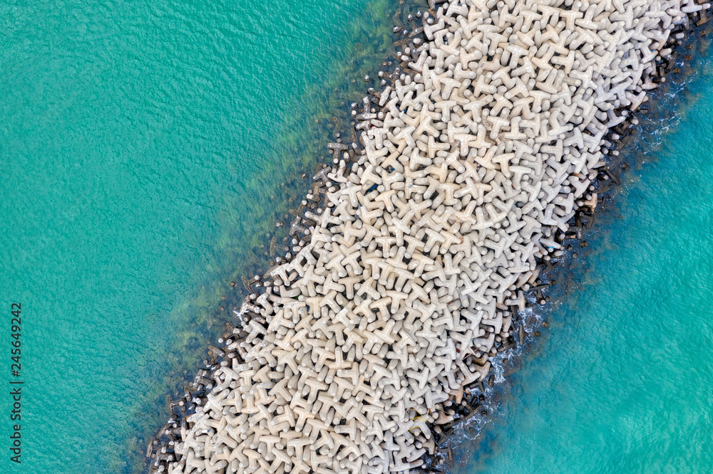 Tetrapod Breakwater in turquoise water, taken in Kuwait in December 2018 taken in hdr