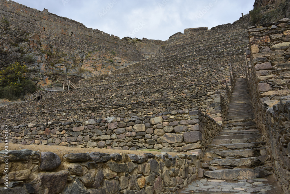 Cusco, Peru - Oct 22, 2018: Stone buildings and terraces at the Ollantaytambo archaeological site in the Sacred Valley