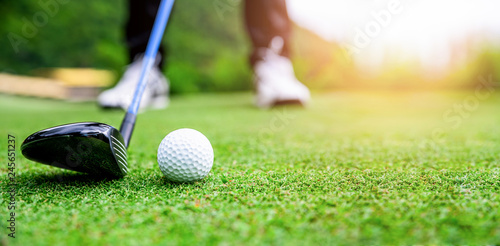Obraz na plátne Close up golf ball on green grass field