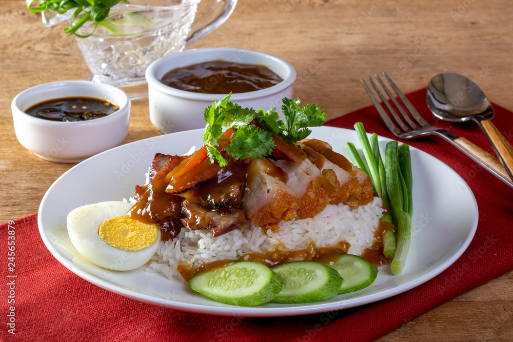 Red pork rice on a wood background Red pork rice on a wood background