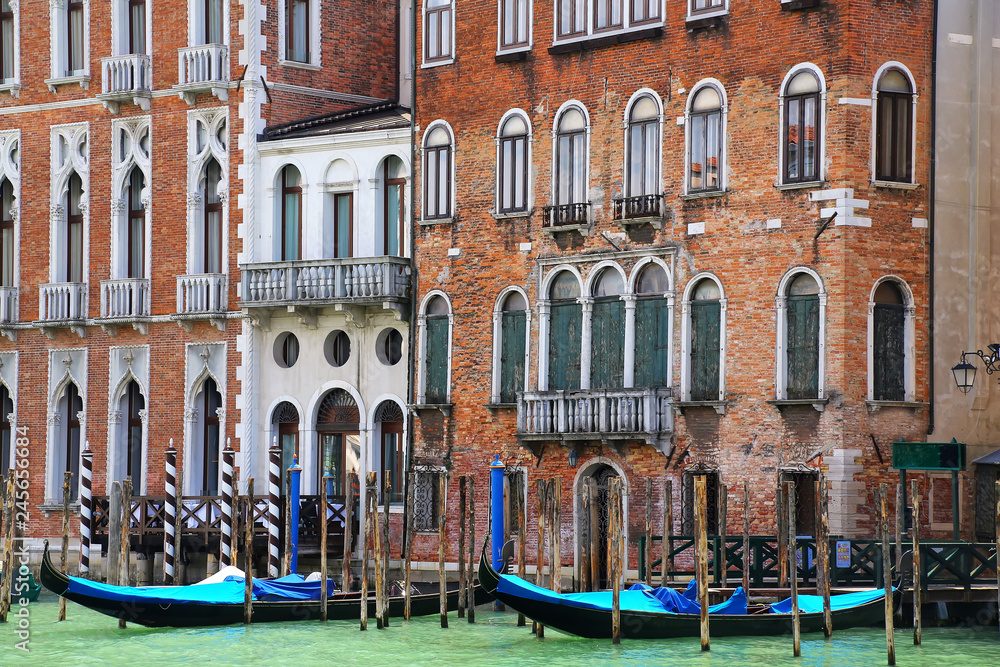 Houses with moored gondolas along Grand Canal in Venice, Italy