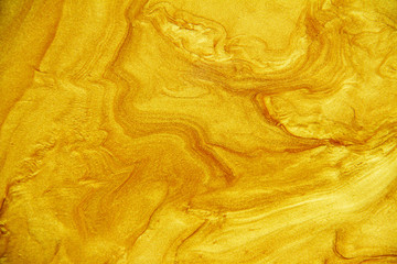 Golden acrylic background texture.