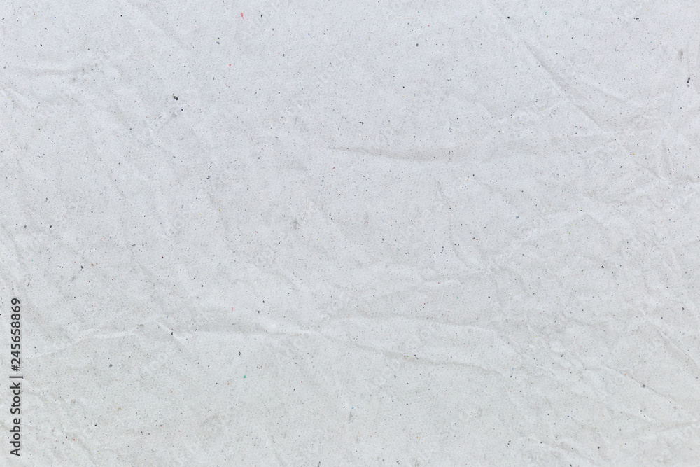 Obraz premium Crumpled white recycled paper background for business communication and education concept design.