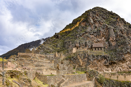 Cusco, Peru - Oct 22, 2018: Stone buildings and terraces at the Ollantaytambo archaeological site in the Sacred Valley