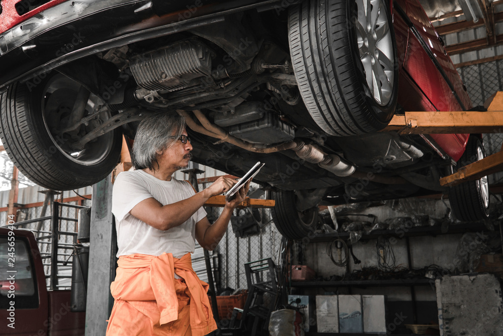 custom made wallpaper toronto digitalmechanic engineer repair the car and checklist fix item with tablet in the garage - Image