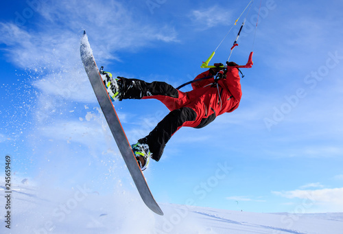 Weekend activities - snowkiting! Extreme and fun! A trip to the Russian North to kite in show white tundra is a great trip adventure! Freestyle rotation high move trick with board snow powder action