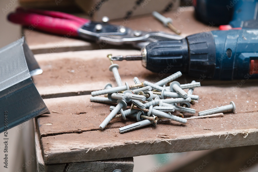 Closeup dusty construction building tools on the scaffolding