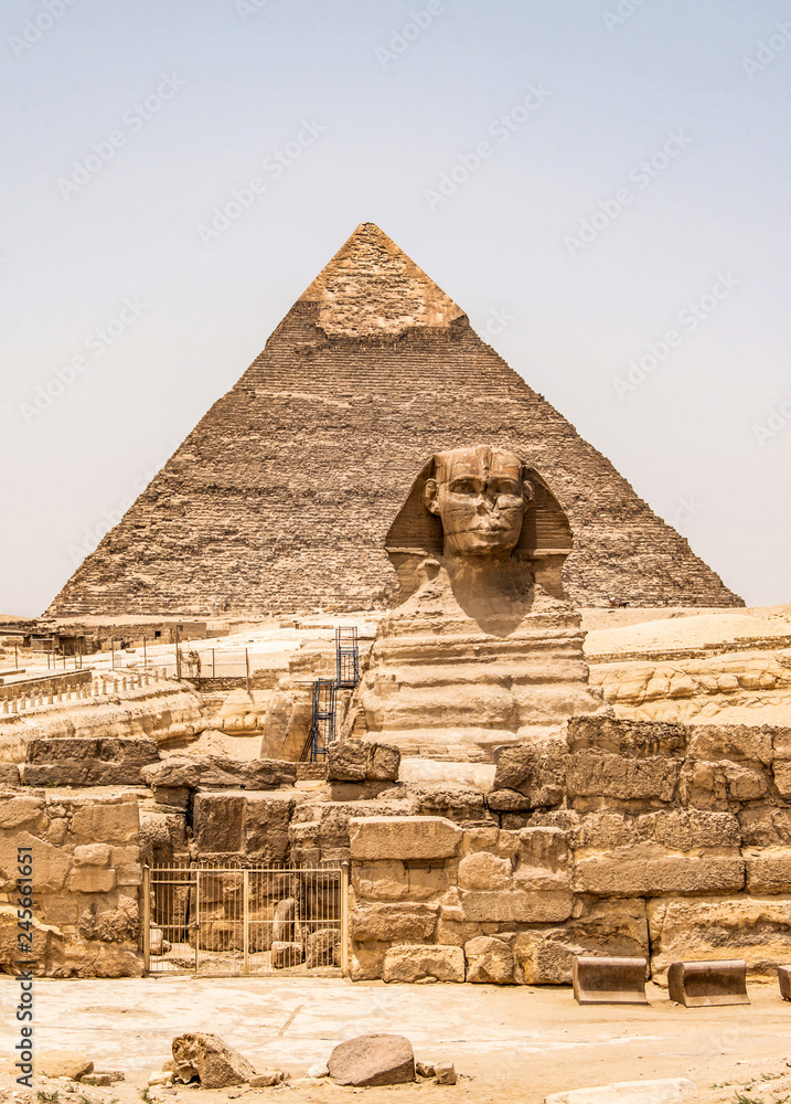 Egyptian Great Sphinx full body portrait head,with pyramids of Giza background Egypt empty with nobody. copy space Egyptian Great Sphinx full body portrait head,with pyramids of Giza background Egypt empty with nobody. copy space