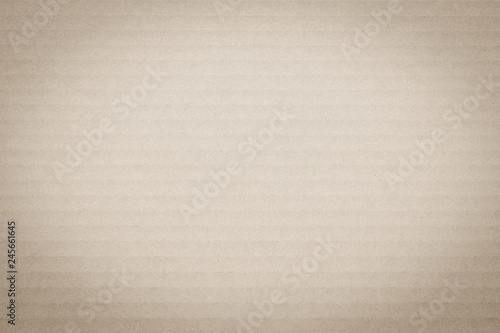 Light cream beige brown color corrugated cardboard paper texture background..