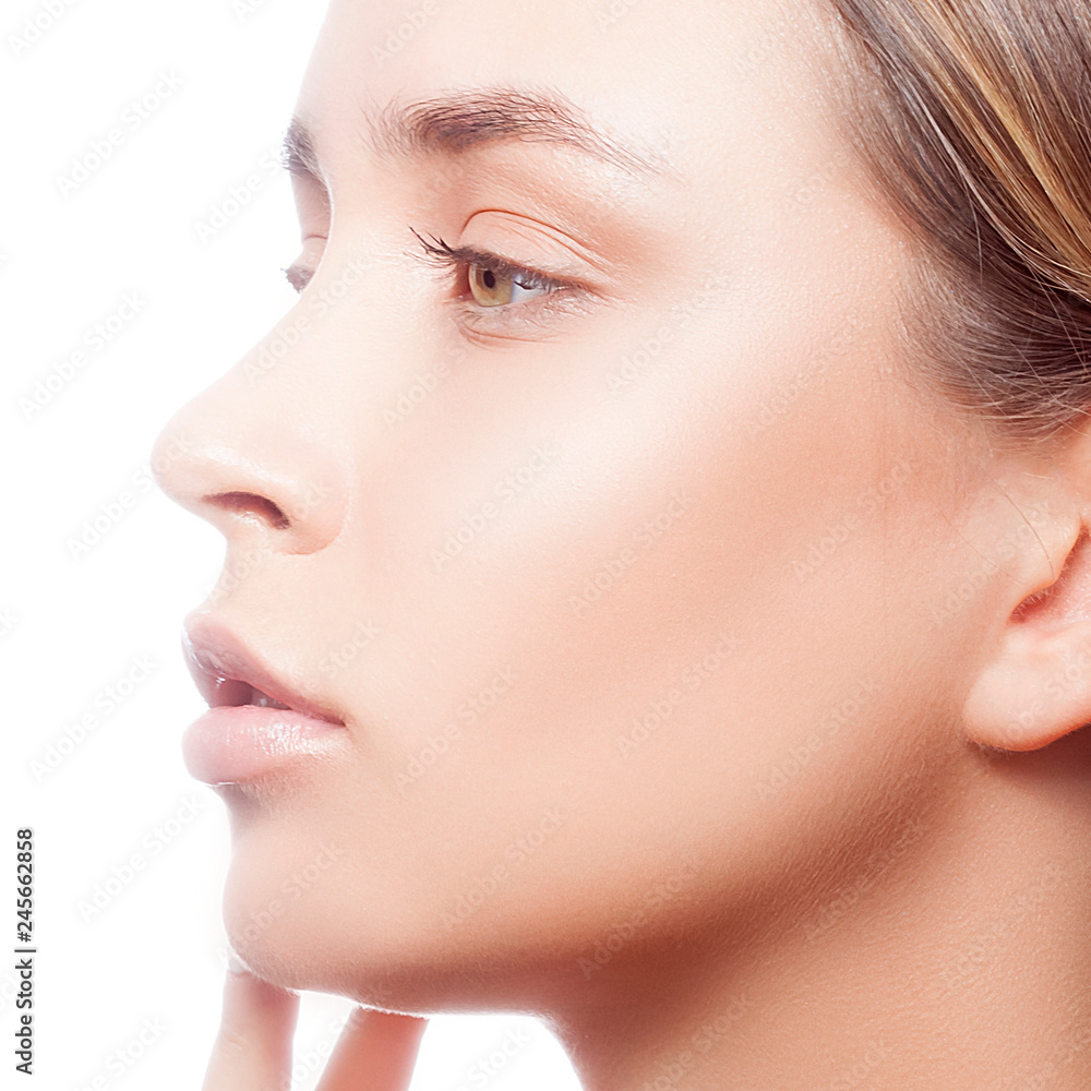 Attractive close-up beauty face of young adult model woman with clean fresh  skin, natural nude make-up. Studio portrait Stock Photo | Adobe Stock