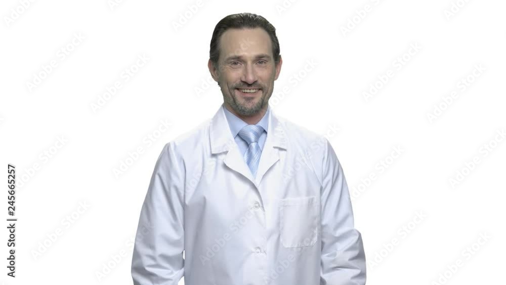 Handsome man in white coat looking at camera. Portrait of smiling mature doctor or science specialist isolated on white background. People, occupation, lifestyle. Handsome man in white coat looking at camera. Portrait of smiling mature doctor or science specialist isolated on white background. People, occupation, lifestyle.
