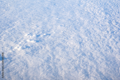 View from airplane, white clouds in rainy season and nice blue sky, bird eye view