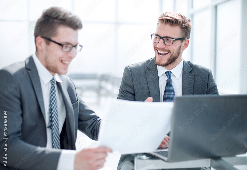 business partners discussing business document. business partners discussing business document.