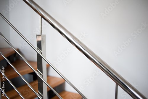 Modern wooden stairs and metal railings