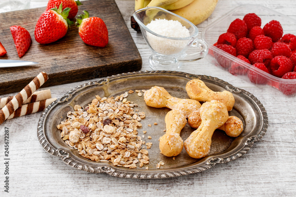 Ingredients for tasty and healthy dessert - fruits and oatmeal flakes.