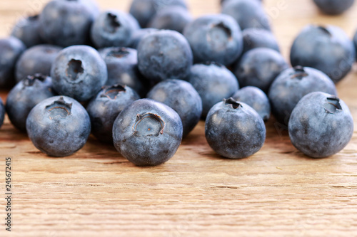 Blueberries on wooden table.