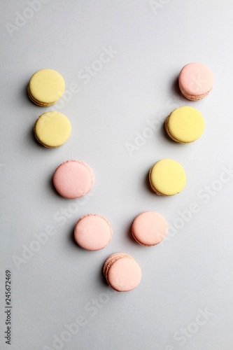 Alphabet letters made of sweet french macaroons.