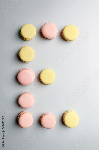 Alphabet letters made of sweet french macaroons.