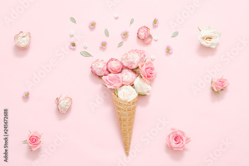 Conceptual art. Creative rose bouquet present on festive pink background.