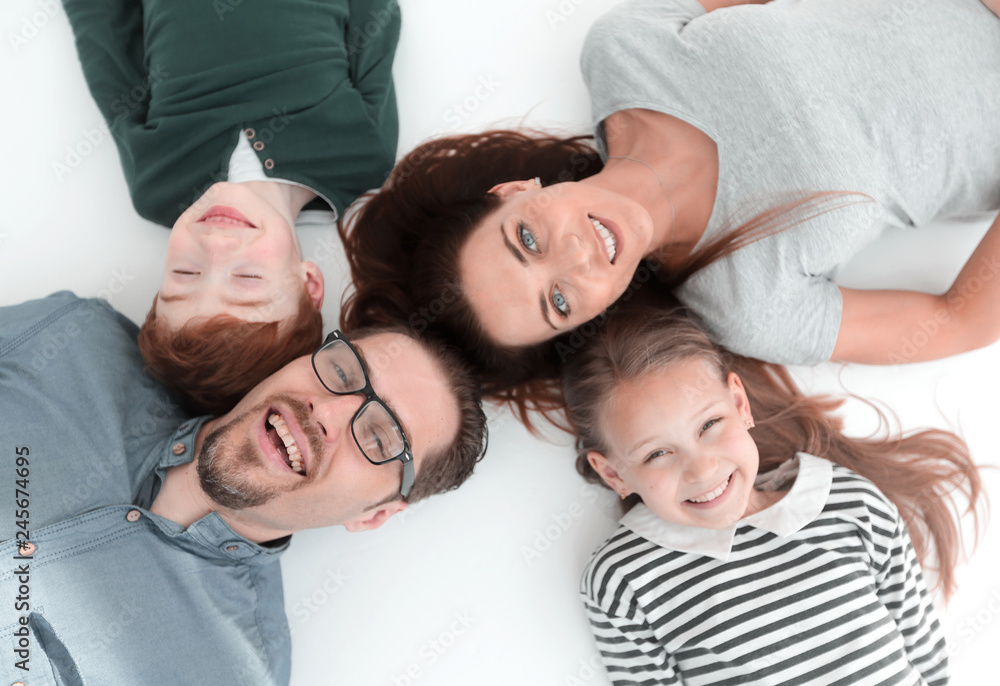 top view. happy family lying on the floor top view. happy family lying on the floor