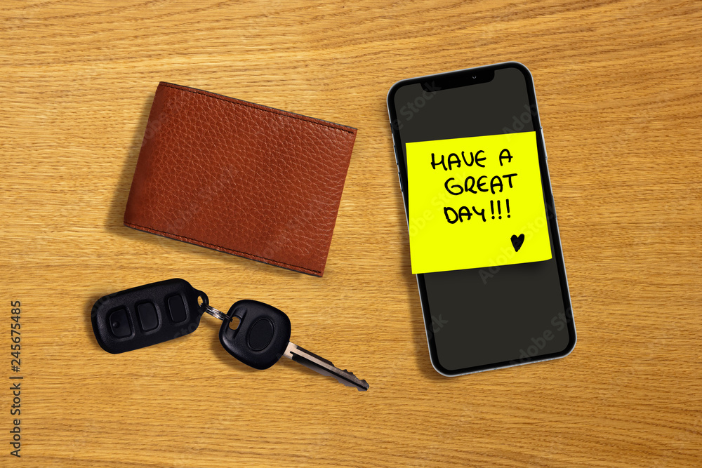 have a great day romantic and sweet handwritten note on yellow posit stick to mobile phone next to car key and leather wallet in woman leaving love message to husband have a great day romantic and sweet handwritten note on yellow posit stick to mobile phone next to car key and leather wallet in woman leaving love message to husband