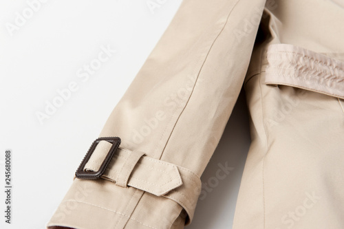 Partial detail of cuffs in beige trench coat