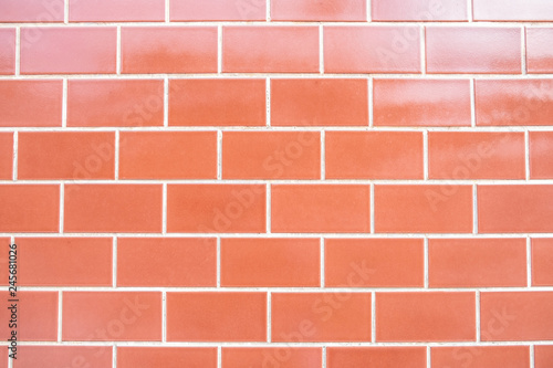 Red brick wall background with light reflection