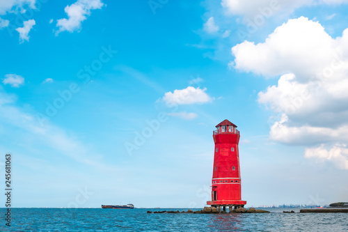 View of lighthouse at Sunda Kelapa harbor, the gate to Jakarta port of Indonesia photo