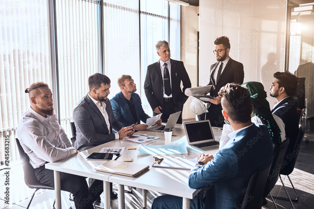 leader of company and his partners are designing a new product indoors. engineering leader of company and his partners are designing a new product indoors. engineering