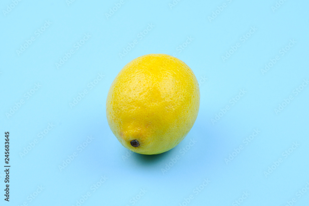 Lemon isolated on blue background. Space for test or design. Lemon isolated on blue background. Space for test or design.