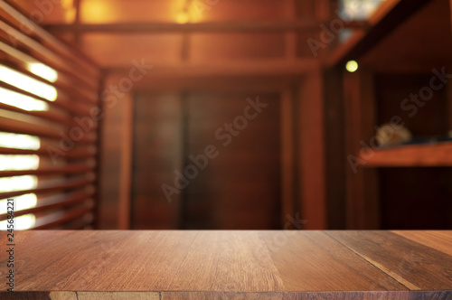 wooden table with blurred modern home background