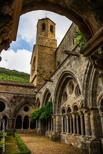 Carcassonne, France - 2019. Fontfroide Abbey monastery in France.Gothic walls and arches. photo