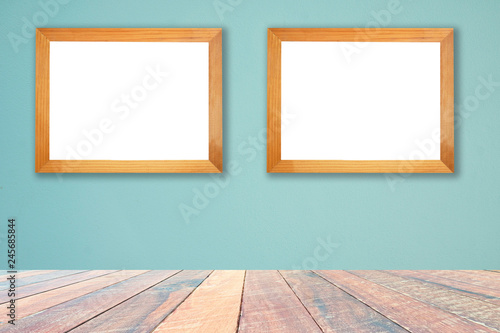 Green wall and empty wood desk and Wooden frame .Blank space for text and images.