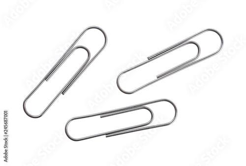 Silver paper clips isolated on white background photo