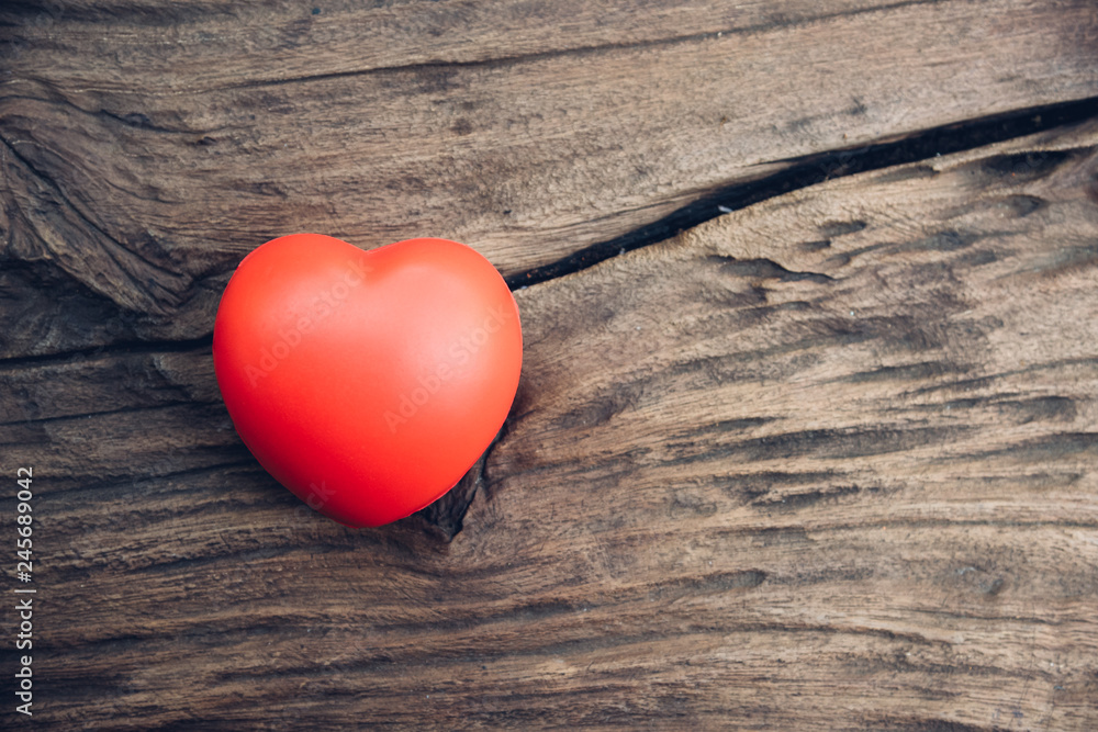 Fototapeta premium Red heart love on wooden background