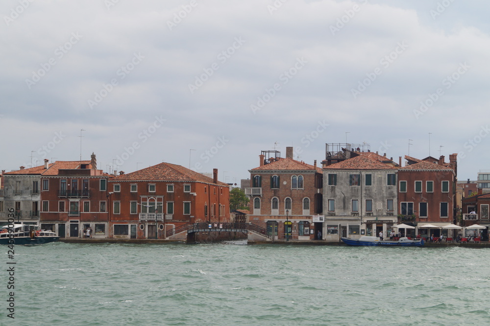 on a boat through the canals of venice