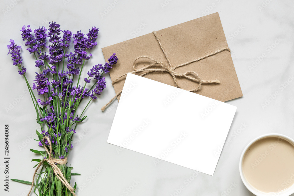 mock up blank greeting card and envelope with lavender flowers and cup of cappuccino with copy space. top view mock up blank greeting card and envelope with lavender flowers and cup of cappuccino with copy space. top view