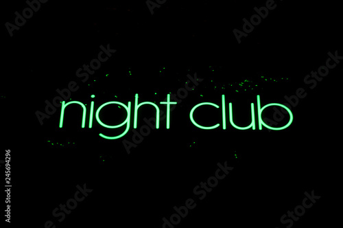 Closeup of green night club sign on white background