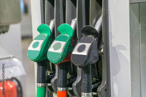 Colorful Petrol pump filling nozzles , Gas station in a service