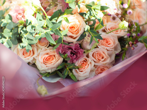 Wedding bouquet with roses, peas, berry, leaves Selective focus. Florist's job