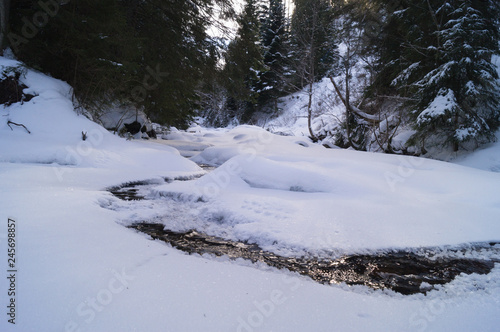 Winter adventures. Creek in the snow. Carpathians. Ukraine. © Aleksey