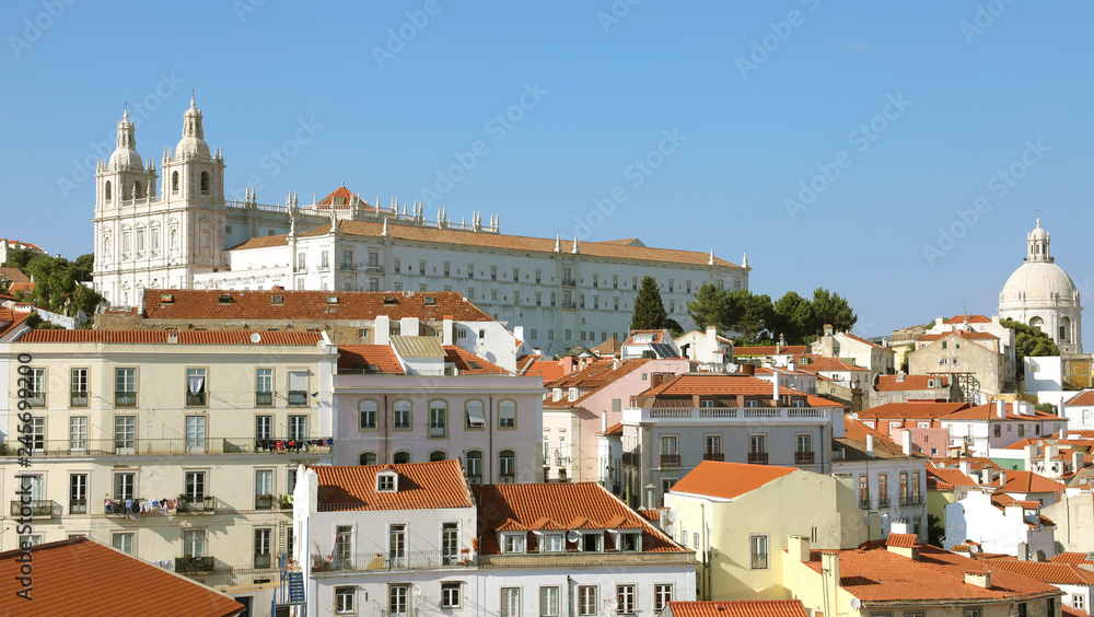 Alfama old district with Monastery of Sao Vicente de Fora with dome of Santa Engracia in a beautiful summer day in Lisbon, Portugal
