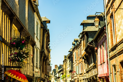 Hondleur, France - 2019.On the streets of an medieval city Honfleur. Favorite place for walks of local residents and tourists. photo