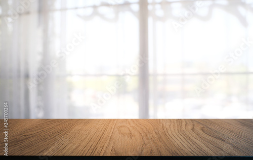 Empty dark wooden table in front of abstract blurred bokeh background of restaurant . can be used for display or montage your products.Mock up for space.